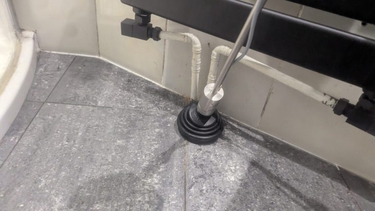 Gas tracing a central heating leak leak detected to central heating pipe beneath the tiled floor.